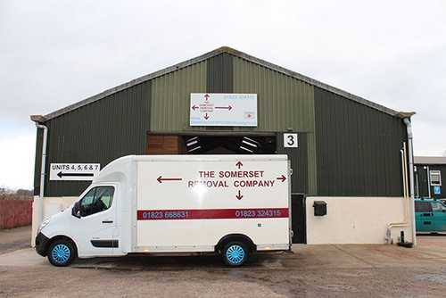 Straight on view of the Somerset Removal Company large van outside the warehouse